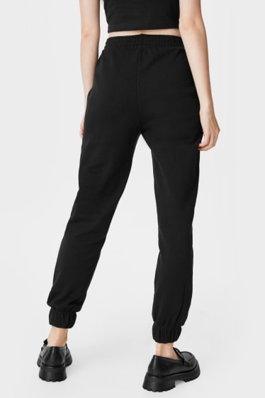 Dámské - CLOCKHOUSE - teplákové kalhoty - s lesklou aplikací - černá