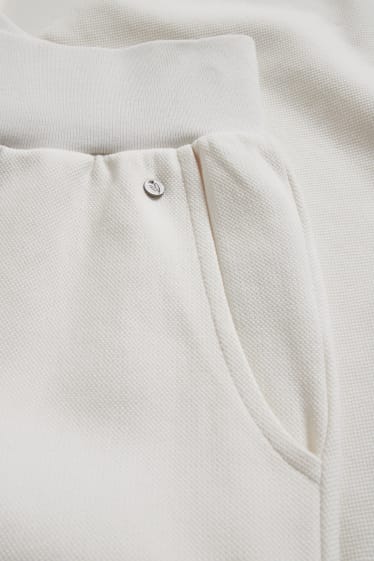 Dámské - Teplákové kalhoty - krémově bílá