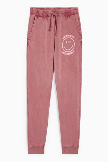 Femmes - CLOCKHOUSE - pantalon de jogging - SmileyWorld® - violet clair