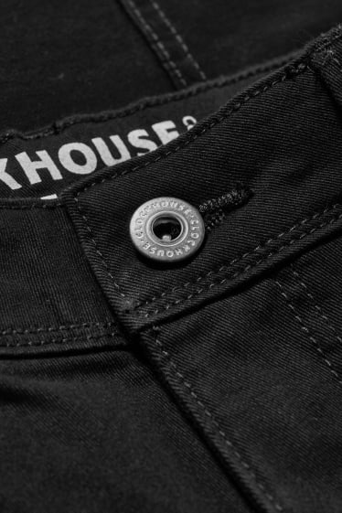 Nastolatki - CLOCKHOUSE - spodnie bojówki - skinny fit - czarny