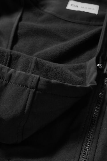 Dámské - Softshellová těhotenská bunda s kapucí - nosící - černá