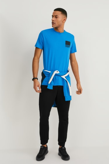 Uomo - Pantaloni sportivi - nero