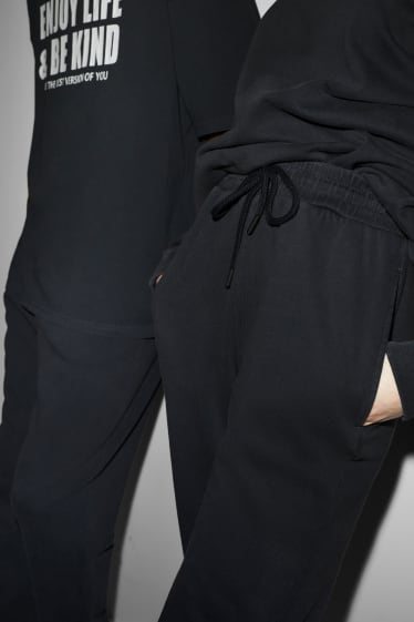 Nastolatki - CLOCKHOUSE - spodnie dresowe - unisex - czarny