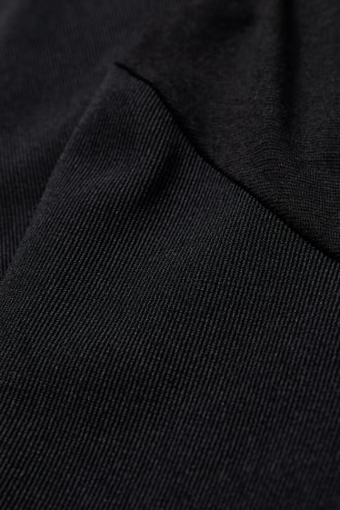 Women - Jersey maternity trousers - flared - black