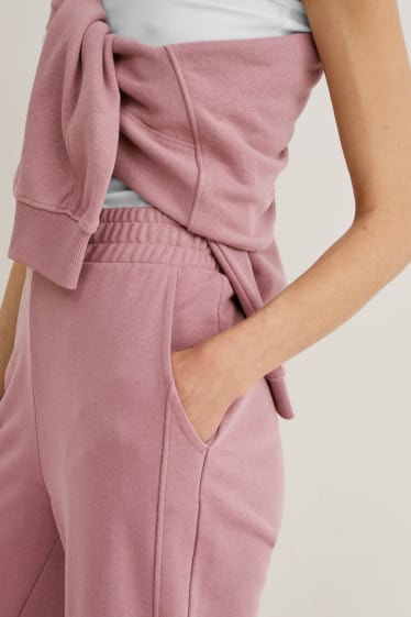 Donna - Pantaloni in jersey - palazzo - rosa scuro