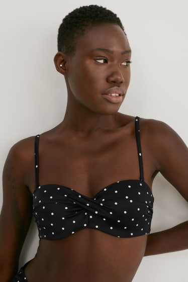 Donna - Top bikini con ferretti - fascia - imbottito - pois - nero / bianco