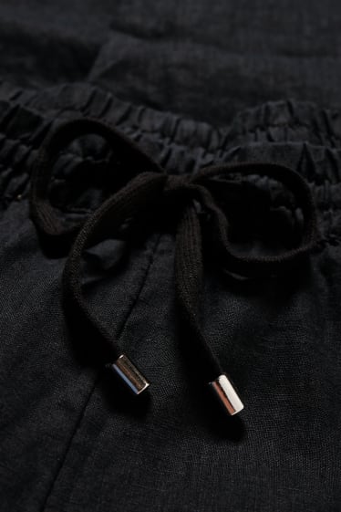 Women - Linen trousers - tapered fit - black