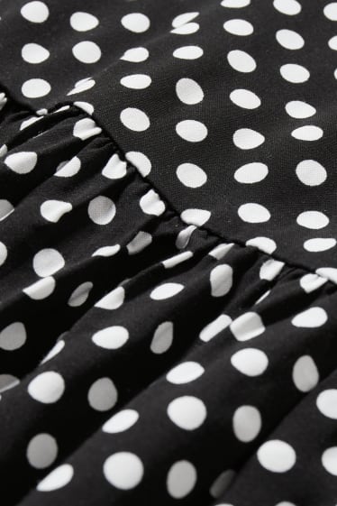Dámské - Áčkové šaty - puntíkované - černá/bílá