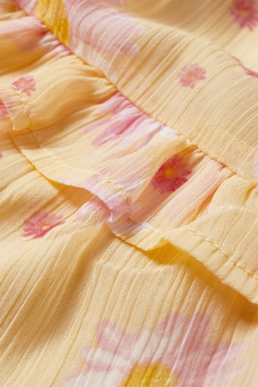 Nastolatki - CLOCKHOUSE - sukienka fit & flare z supełkiem - w kwiaty - żółty