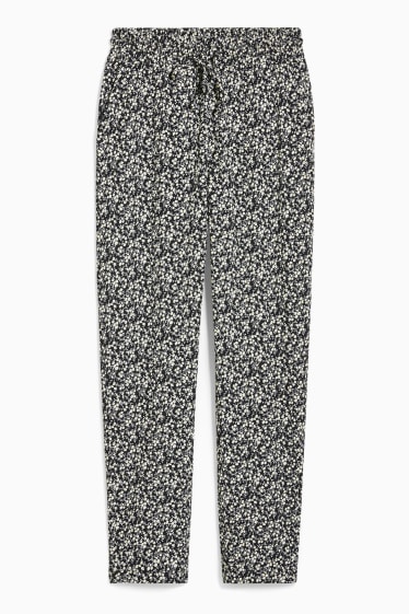 Jóvenes - CLOCKHOUSE - pantalón de tela - tapered fit - de flores - negro