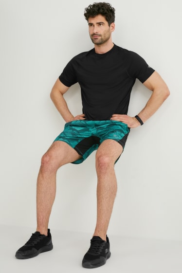 Hombre - Shorts funcionales - running - negro / turquesa