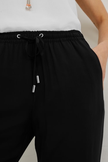Dámské - Plátěné kalhoty - tapered fit - černá