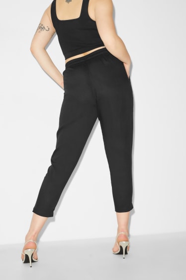 Kobiety - CLOCKHOUSE - spodnie z materiału - tapered fit - czarny