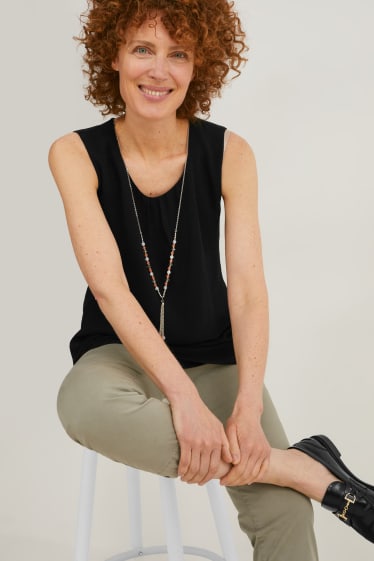Damen - Chiffon-Blusentop mit Kette - schwarz