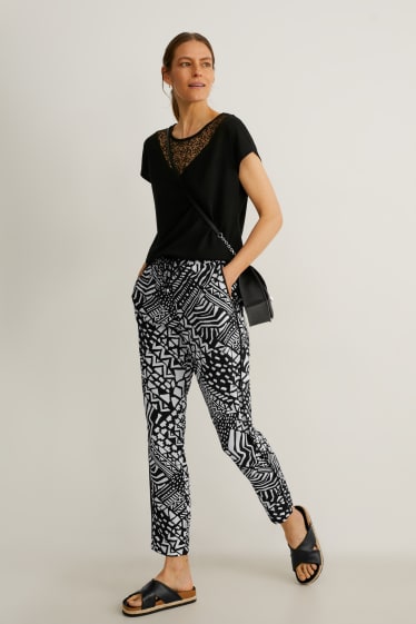 Dames - Pantalon - tapered fit - zwart / wit