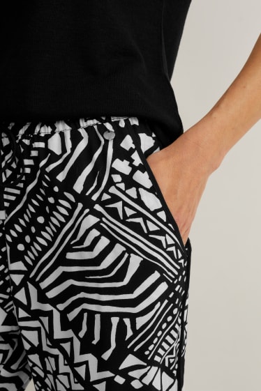 Mujer - Pantalón de tela - tapered fit - negro / blanco