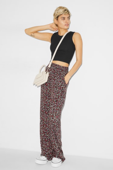Teens & young adults - CLOCKHOUSE - cloth trousers - high waist - wide leg - floral - multicoloured