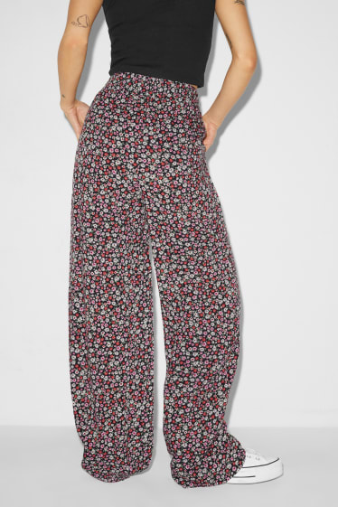 Dospívající a mladí - CLOCKHOUSE - plátěné kalhoty - high waist - wide leg - s květinovým vzorem - barevná