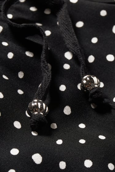 Dámské - Těhotenské kalhoty - palazzo- puntíkované - černá