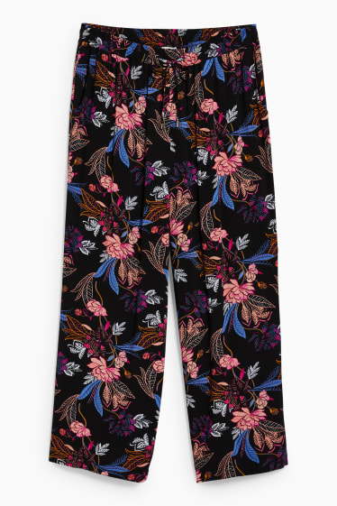 Kobiety - Spodnie materiałowe - średni stan - szerokie nogawki - w kwiaty - czarny