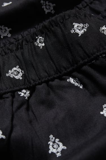 Dámské - Plátěné kalhoty - mid waist - tapered fit - se vzorem - černá