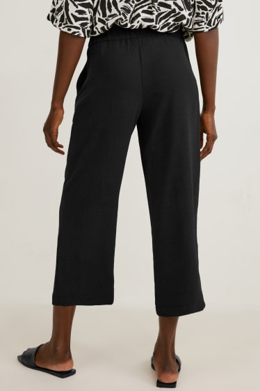 Dámské - Plátěné kalhoty - mid waist - wide leg - černá