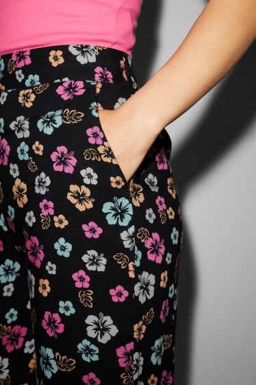 Donna - CLOCKHOUSE - pantaloni di stoffa - vita alta - gamba ampia - a fiori - nero