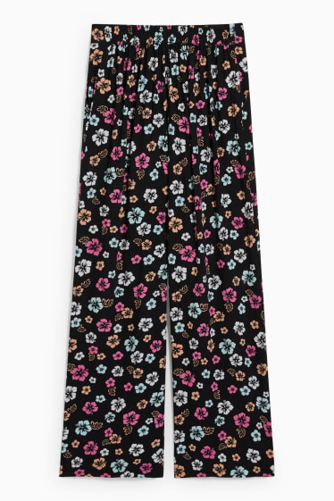 Dospívající a mladí - CLOCKHOUSE - plátěné kalhoty - high waist - wide leg - s květinovým vzorem - černá