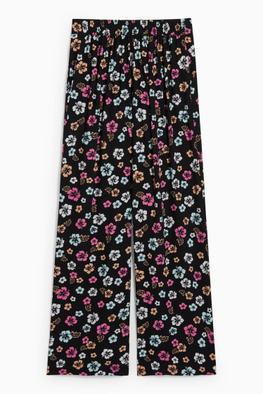 Jóvenes - CLOCKHOUSE - pantalón de tela - high waist - wide leg - de flores - negro