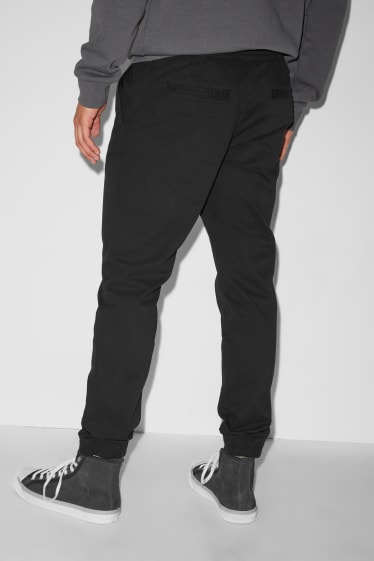 Uomo - CLOCKHOUSE - pantaloni - tapered fit - nero