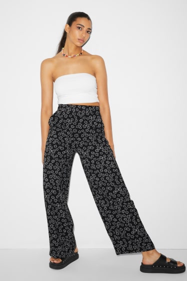 Femmes - CLOCKHOUSE - pantalon en toile - high waist - jambes larges - à fleurs - noir