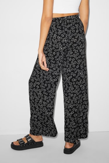 Femmes - CLOCKHOUSE - pantalon en toile - high waist - jambes larges - à fleurs - noir