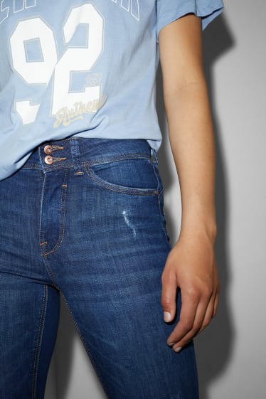 Nastolatki - CLOCKHOUSE - skinny jeans - średni stan - efekt push-up - dżins-niebieski