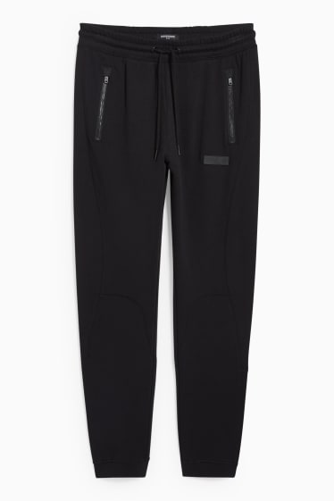 Hommes - CLOCKHOUSE - pantalon de jogging - noir