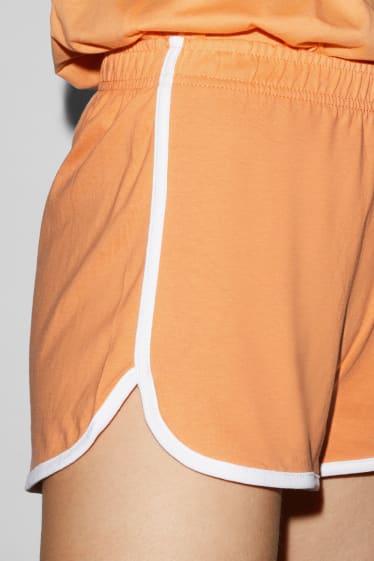 Dámské - CLOCKHOUSE - Recover™ - teplákové šortky - oranžová