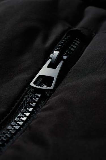 Femmes - Doudoune sans manches à capuche - noir