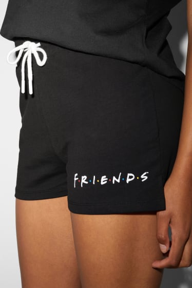 Adolescenți și tineri - CLOCKHOUSE - pantaloni scurți trening - Friends - negru