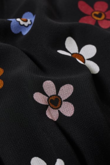 Dona - CLOCKHOUSE - vestit - flors - negre