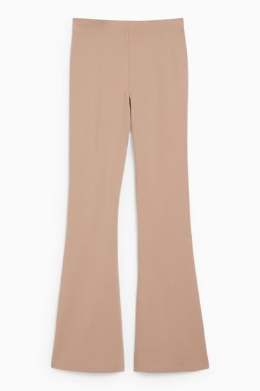 Kobiety - CLOCKHOUSE - dżersejowe spodnie - flared - jasnobrązowy
