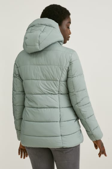 Women - Maternity quilted jacket with hood and baby pouch - mint green