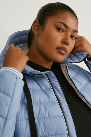 Women - Quilted jacket with hood - light blue