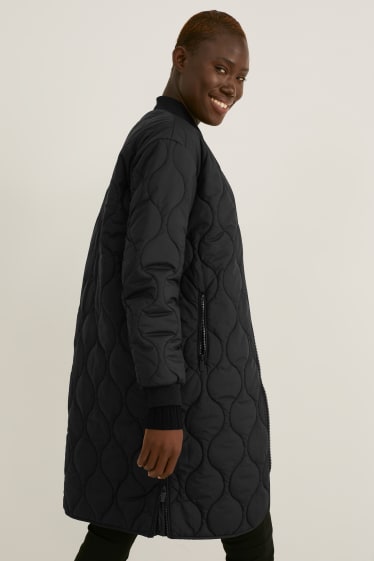 Dona - Abric embuatat - negre