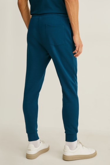 Hommes - Pantalon de jogging - turquoise foncé