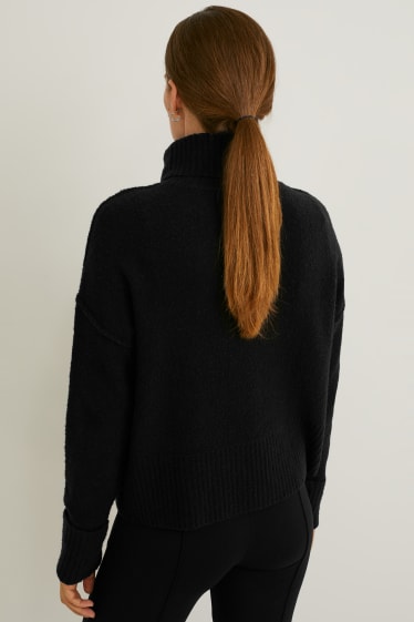 Damen - Bouclé-Rollkragenpullover - schwarz