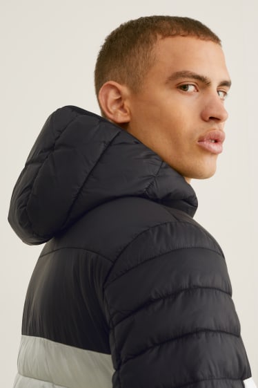 Men - Quilted jacket with hood - white / black