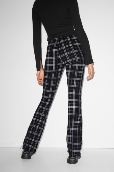 Joves - CLOCKHOUSE - pantalons de punt - flared - de quadres - negre/gris