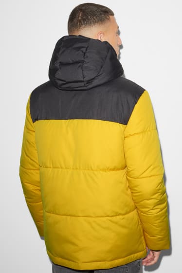 Mężczyźni - CLOCKHOUSE - kurtka pikowana z kapturem - żółty