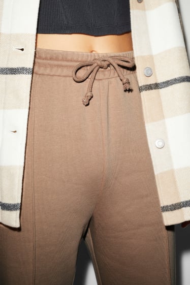 Donna - CLOCKHOUSE - pantaloni di felpa - palazzo - marrone chiaro