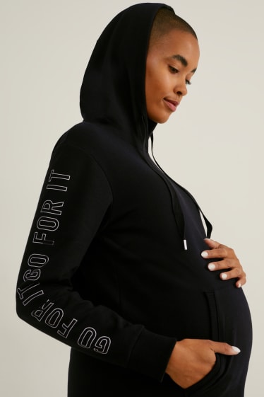 Dámské - Těhotenské teplákové šaty s kapucí - černá