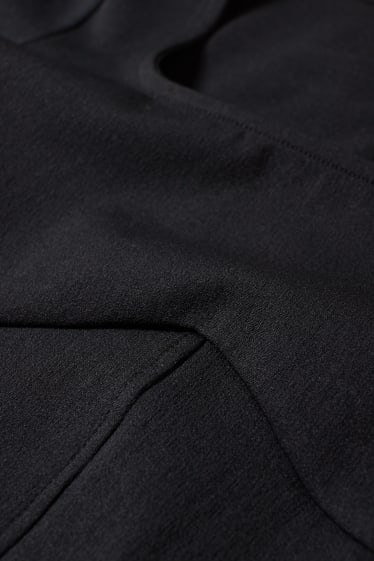 Joves - CLOCKHOUSE - samarreta de màniga llarga crop - negre
